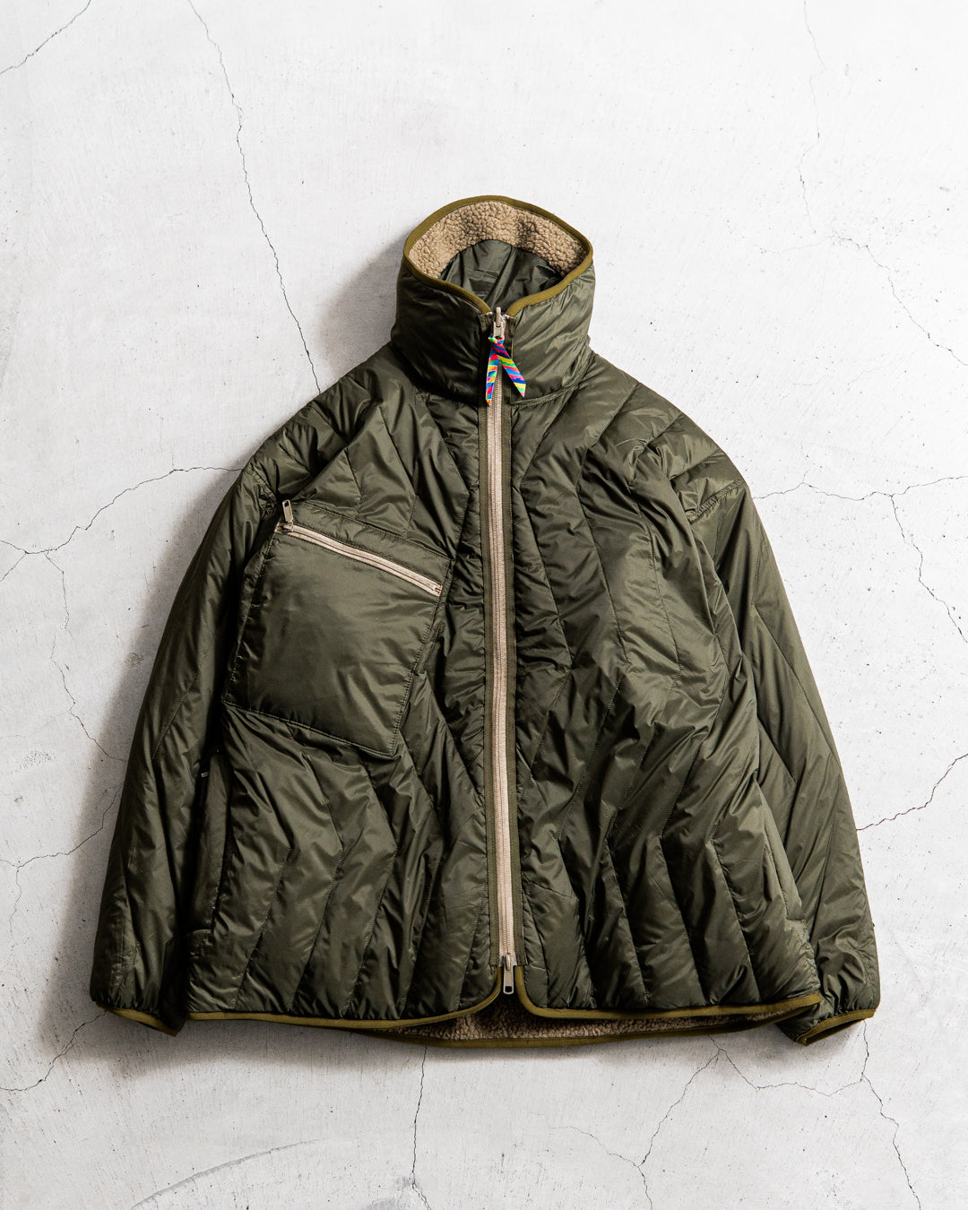 通販] is-ness(イズネス) is-ness × TAION REVERSIBLE FLEECE DOWN