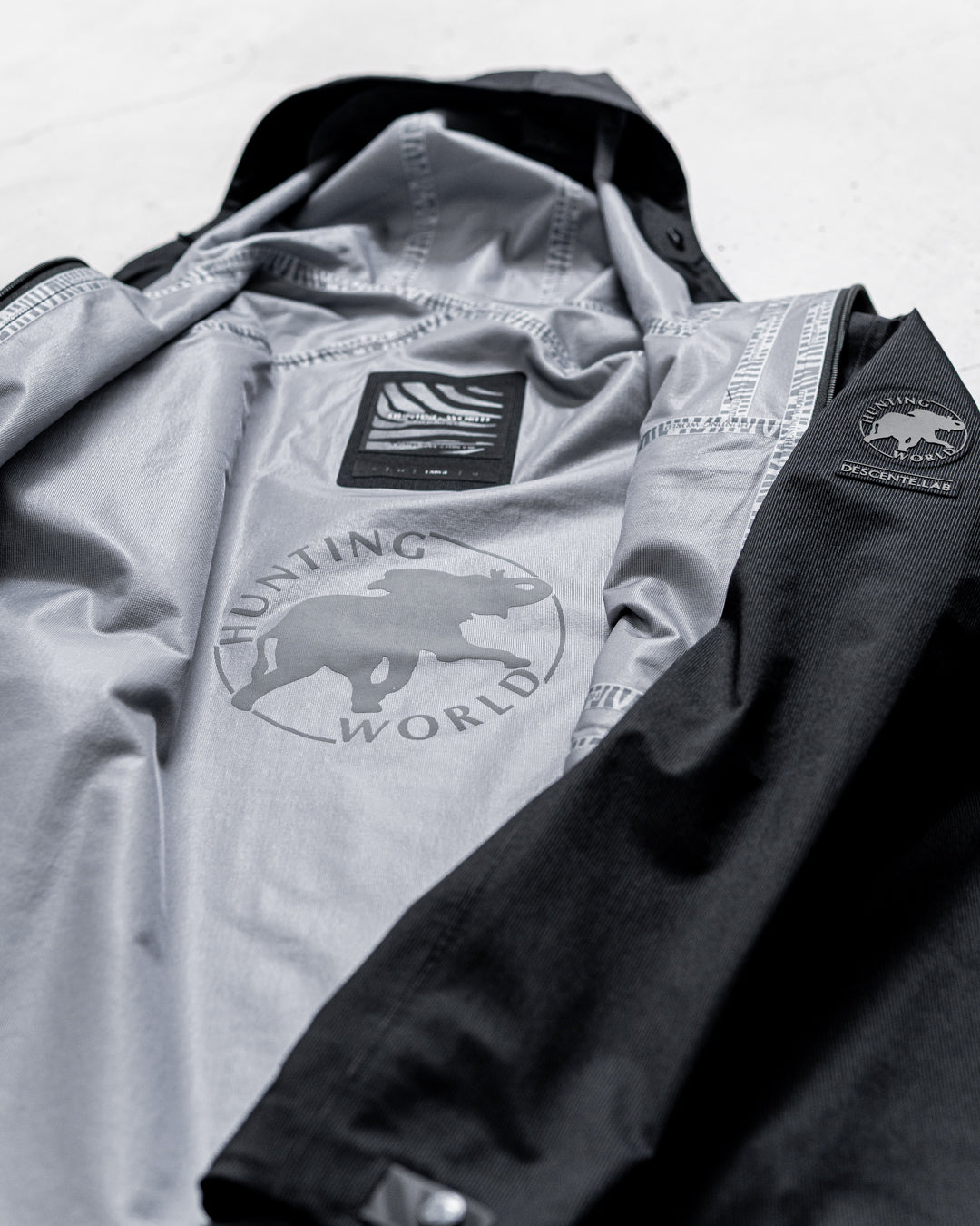 【limited】HUNTING WORLD CRAFTED BY DESCENTE.LAB HARD SHELL ASYMMETRY FIELD JACKET