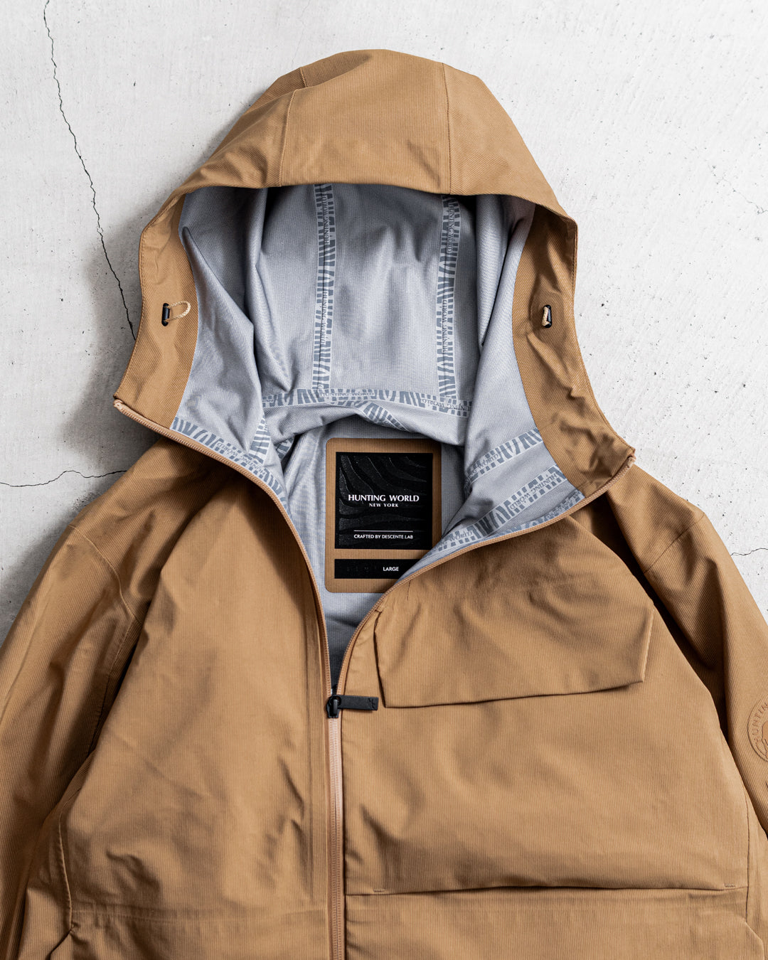 【limited】HUNTING WORLD CRAFTED BY DESCENTE.LAB HARD SHELL ASYMMETRY FIELD JACKET