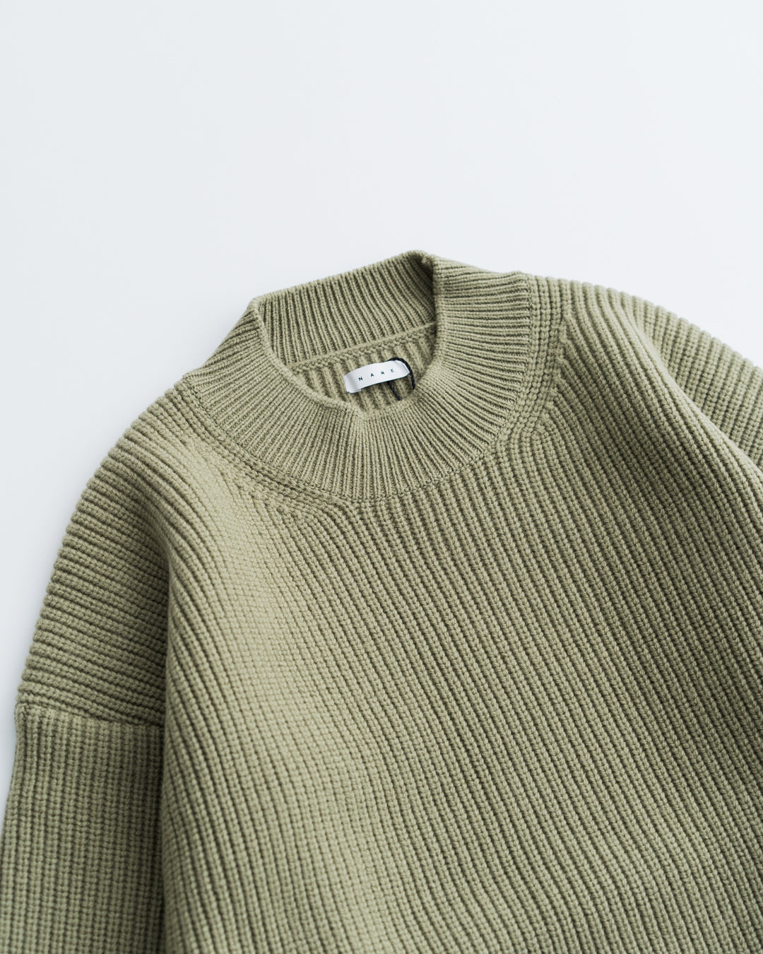 Name. FRENCH WOOL MOCKNECK KNIT SWEATER