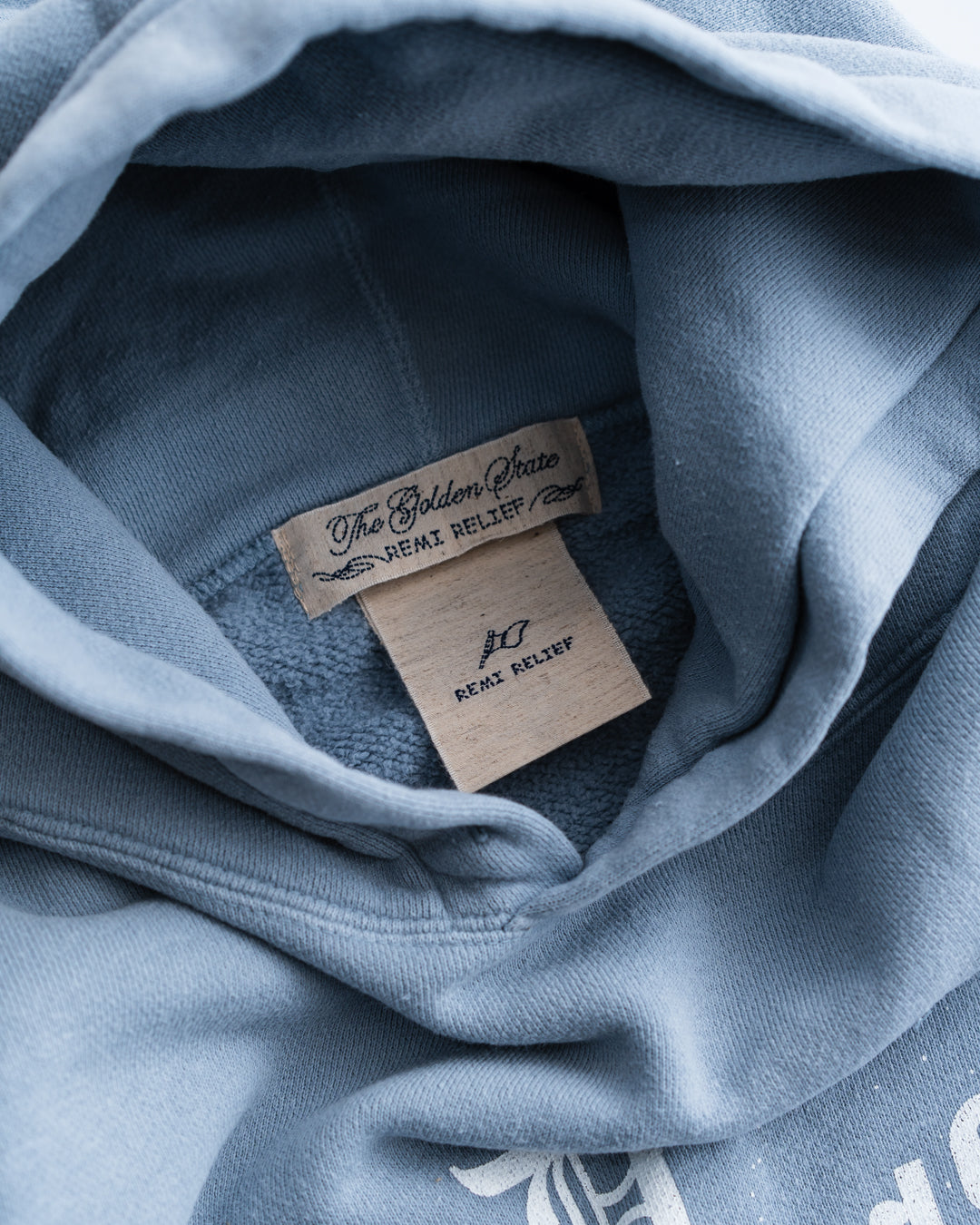 REMI RELIEF SP加工起毛裏毛パーカー(GOD rides a)